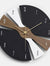 Modern luxury wooden wall clock for living room decor in Pakistan, featuring a 3D geometric propeller design in matte black and walnut wood.