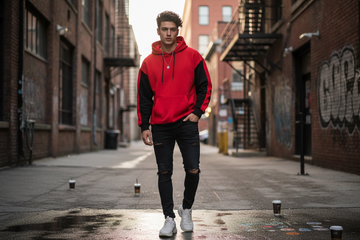 A young man wearing red and black hoddie